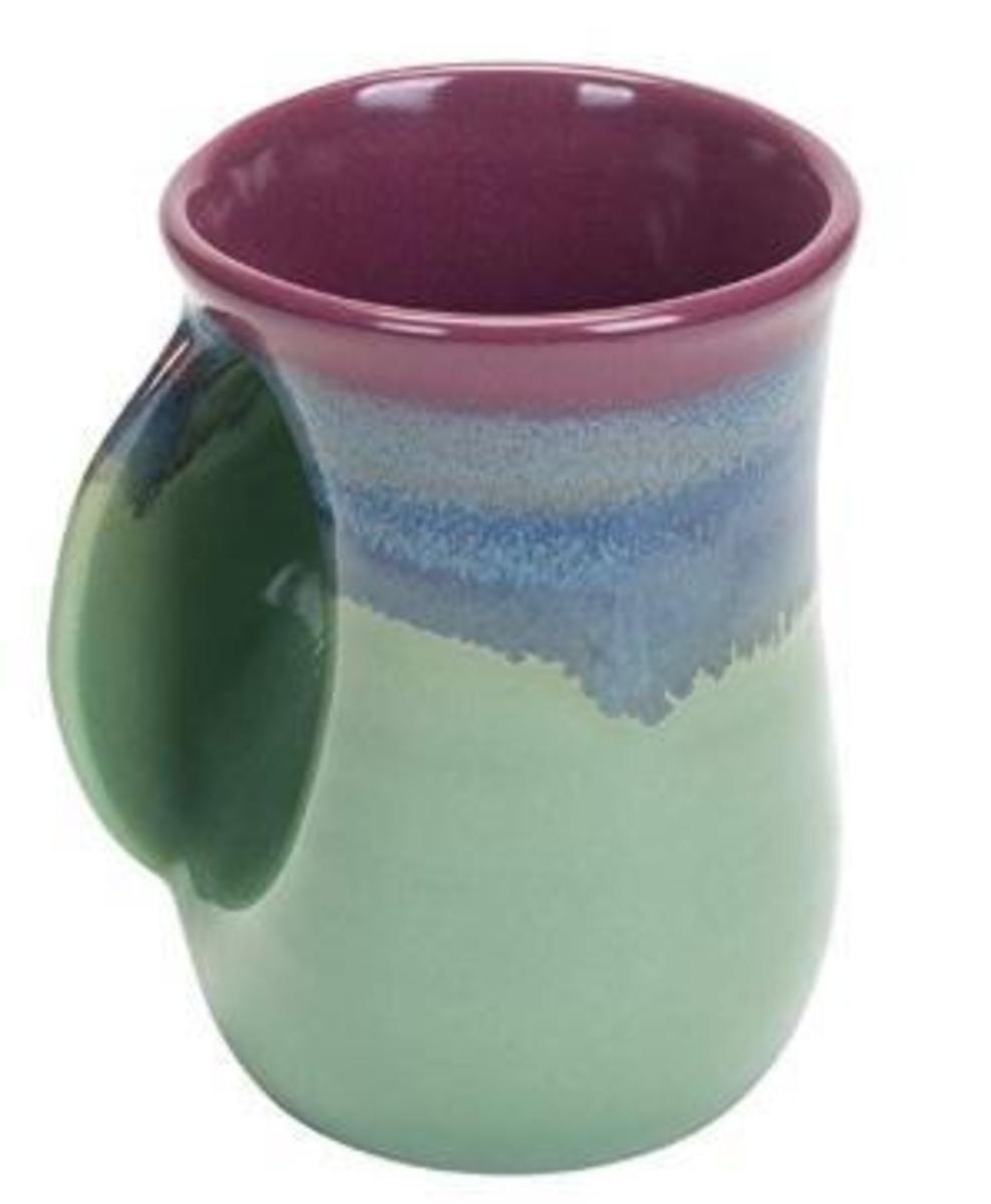 Clay in Motion - handwarmer mug left (Mossy Creek)
